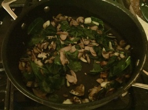Adding in the spinach